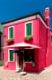 Colorful houses taken on Burano island , Venice, Italy in summer time. Positive color makes beautiful background from them. 