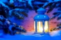 candle light lantern in snow