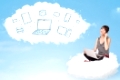 Pretty young woman sitting in cloud with laptop, cloud computing concept