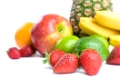 Arrangement of various fresh ripe fruits: pineapple, bananas, orange,  apple, limes and strawberries closeup isolated on white background.